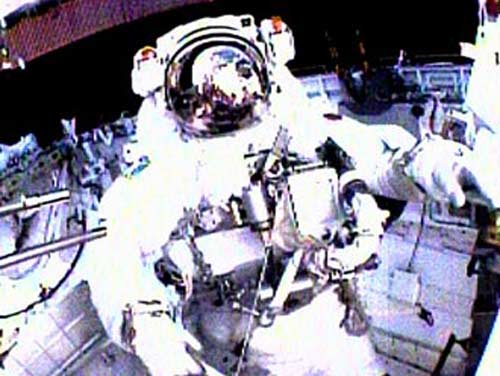 Discovery Astronauts Test Heat Shield Repairs in First Spacewalk