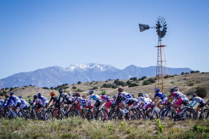 The peloton passes through the rural New Mexico countryside at Tour of the Gila.