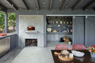 Outdoor kitchen with walk-in pantry and dining table