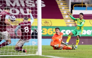 James Tarkowski (left) blocks an effort on the line