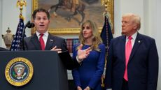Michael Dell stands next to his wife Susan and President Donald Trump.
