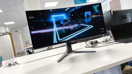 Alienware 34 AW3423DWF hero image showing a dark scene in Cyberpunk 2077