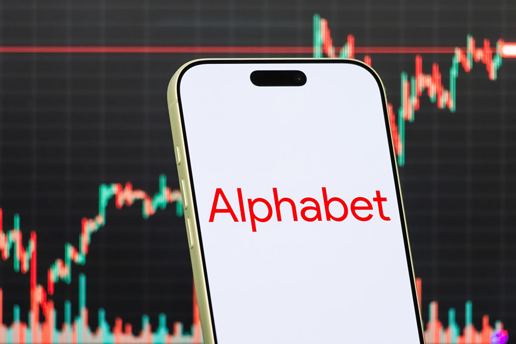the logo of Alphabet, the U.S.-based technology holding company and parent of Google, in front of a screen showing the company's latest stock market chart on January 29, 2026