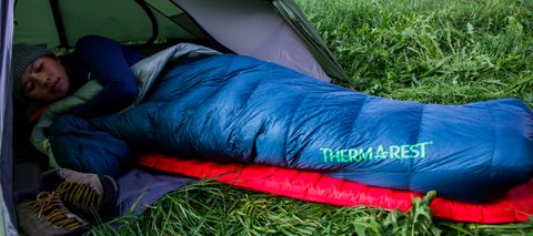 Woman in tent in Therm-a-Rest Hyperion 20F/-6C Sleeping Bag review main image size