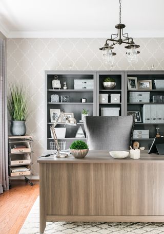 A clean and organzied office space with grey hues across the room