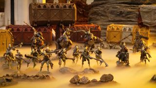 The full Kroot Hunting Pack arrayed on a futuristic desert battlefield