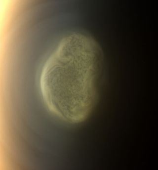 This amazing view of a giant cloud over the south pole of Titan, Saturn's largest moon, was taken by NASA's Cassini spacecraft on June 27, 2012. The cloud is made up of toxic cyanide gas, new studies have found.