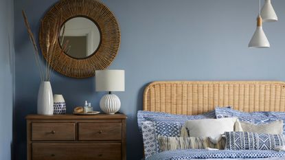 blue bedroom with woven headboard