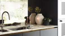 double kitchen sink on a counter with sink drain grooves across the surface