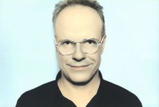 man against blue background