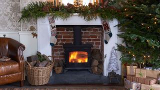 Hearth, Property, Fireplace, Heat, Christmas decoration, Home, Gas, Fire screen, Wicker, Flame,