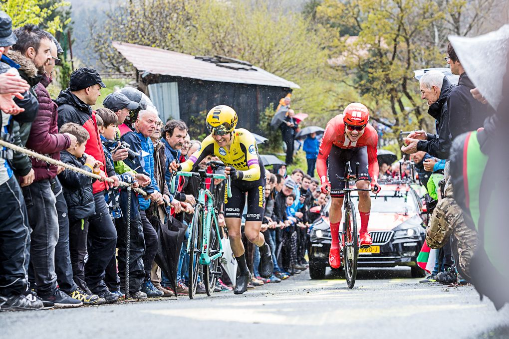 Marc Hirschi rides past Dean Olivier during stage 1 at Pais Vasco