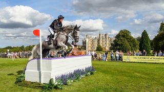 Oliver Townend jumping a hurdle riding Ballaghmor Class on his way to victory at the 2023 Burghley Horse Trials