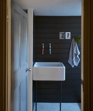 black bathroom ideas, black bathroom with tongue & groove walls, grey flooring, white ceiling, white basin