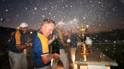 Luke Donald gets sprayed with champagne