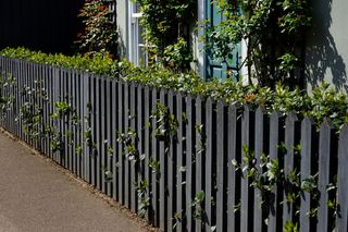 A dark grey fence