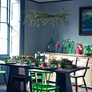 dining area with blue wall with table and chairs