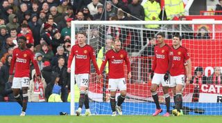 Diogo Dalot, Kobbie Mainoo, Scott McTominay, Raphael Varane, Christian Eriksen, Harry Maguire of Manchester United react to conceding a goal to Calvin Basse of Fulham during the Premier League match between Manchester United and Fulham FC at Old Trafford on February 24, 2024 in Manchester, England. (Photo by Matthew Peters/Manchester United via Getty Images)