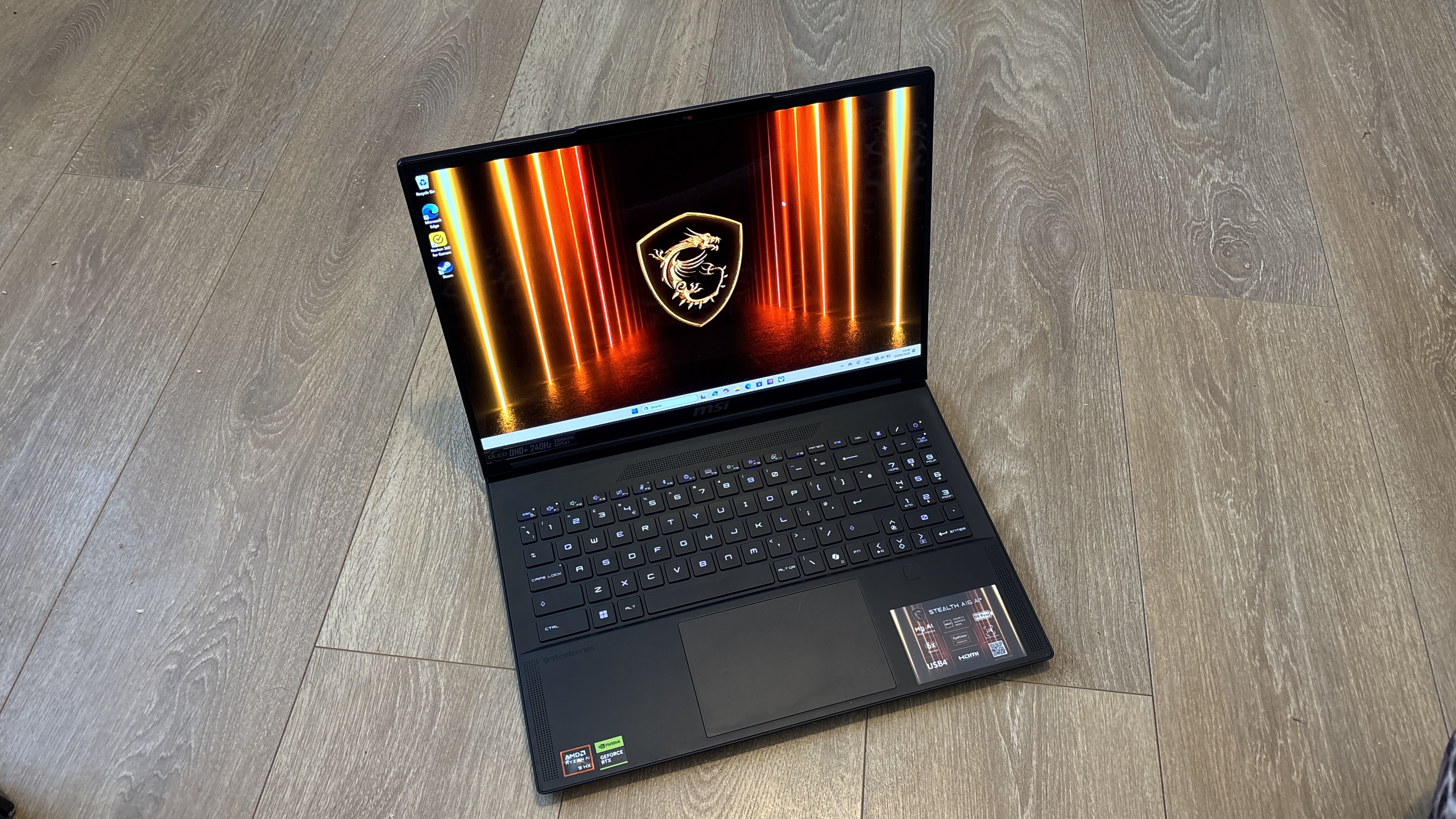 MSI Stealth A16 AI+ on wooden surface
