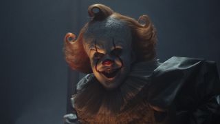 Pennywise smiling in the dark in IT: Welcome to Derry Season 1