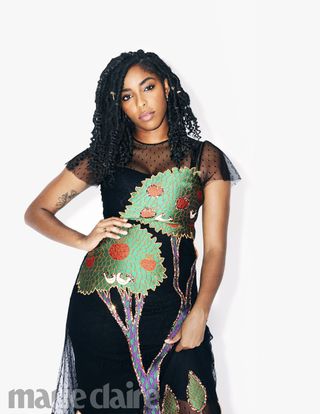 Jessica Williams poses with a hand on her hip.