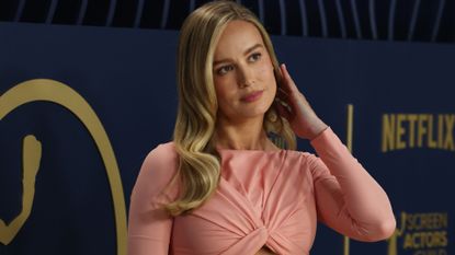Brie Larson arrives at the 2024 sag awards in a pink crop top