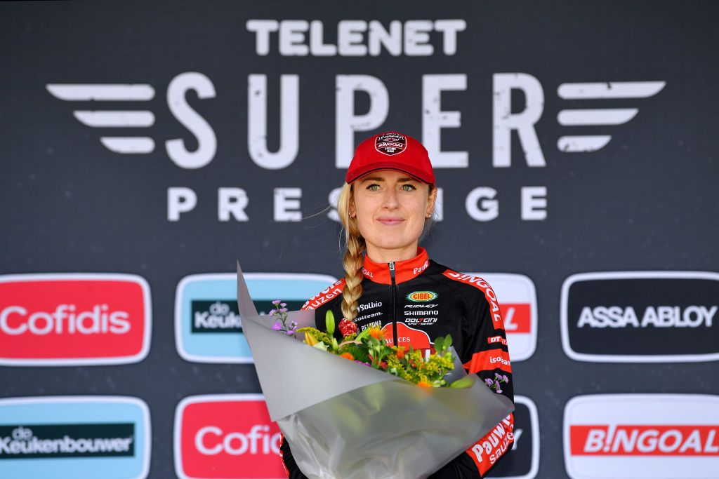 RUDDERVOORDE BELGIUM OCTOBER 23 Denise Betsema of The Netherlands and Team Pauwels Sauzen Bingoal celebrates winning the race on the podium ceremony after the 35th Superprestige Ruddervoorde 2021 Womens Elite CX Superprestige2022 SPRuddervoorde on October 23 2021 in Ruddervoorde Belgium Photo by Luc ClaessenGetty Images