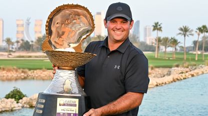 Patrick Reed with the Qatar Masters trophy 