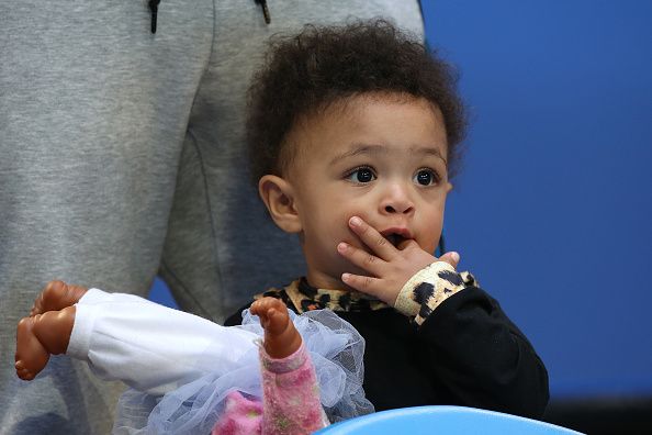 Alexis Olympia Ohanian Jr. watches her mother play.