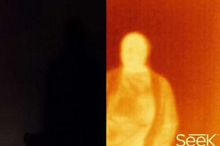 In app side-by-side shot showing a normal camera's view in a dark room and what the Seek sees.