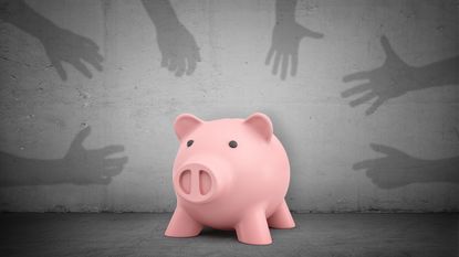 Shadowy hands on a gray background reach for a piggy bank in the middle.