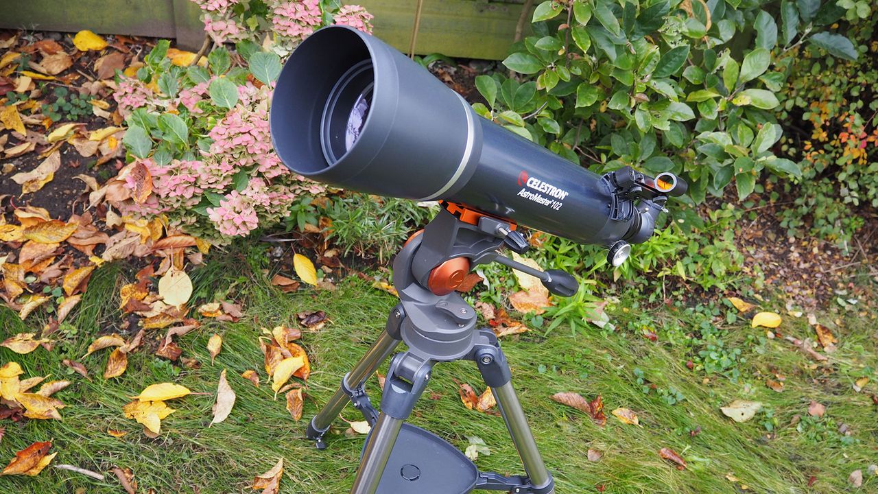 Celestron AstroMaster 102AZ beginner telescope in a garden