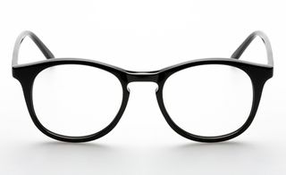 Eyewear from Han Kjobenhavn, Denmark. A rounded pair of glasses with a black frame.