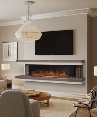 wide, narrow electric fireplace mounted on wall in contemporary living room with taupe coloured painted walls and large cream pendant light