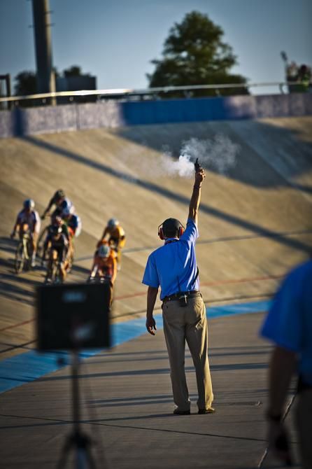 A USA Cycling Official fires the gun to signify the start of the 2014 Women's Miss and Out National Championship