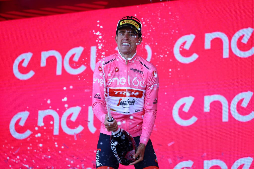 ETNA PIAZZALE RIFUGIO SAPIENZA ITALY MAY 10 Juan Pedro Lpez of Spain and Team Trek Segafredo celebrates at podium with champagne as Pink Leader Jersey winner during the 105th Giro dItalia 2022 Stage 4 a 172km stage from Avola to Etna Piazzale Rifugio Sapienza 1899m Giro WorldTour on May 10 2022 in Etna Piazzale Rifugio Sapienza Italy Photo by Michael SteeleGetty Images