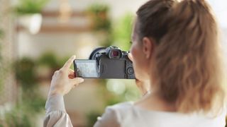 Woman using camera for real estate photography