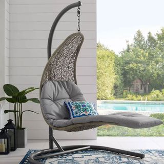 lounge-style hanging chair on a balcony