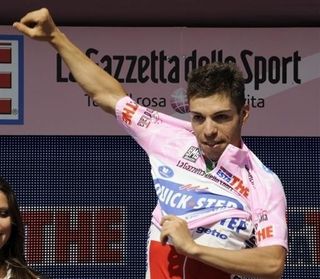 New race leader Giovanni Visconti (Quick Step) puts on the maglia rosa.