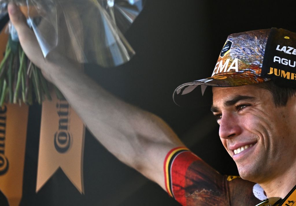 JumboVisma teams Belgian rider Wout Van Aert celebrates his victory on the podium after winning the 20th stage of the 109th edition of the Tour de France cycling race 407 km individual time trial between LacapelleMarival and Rocamadour in southwestern France on July 23 2022 Photo by AnneChristine POUJOULAT AFP Photo by ANNECHRISTINE POUJOULATAFP via Getty Images