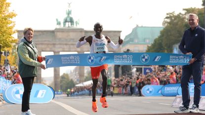 BERLIN, GERMANY - SEPTEMBER 25: Eliud Kipchoge of Kenya crosses the finish line of the 2022 BMW Berlin-Marathon in a new Wolrd Record Time of 2:01:09 h on September 25, 2022 in Berlin, Germany
