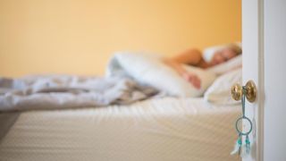 Blonde woman sleeping in a bed