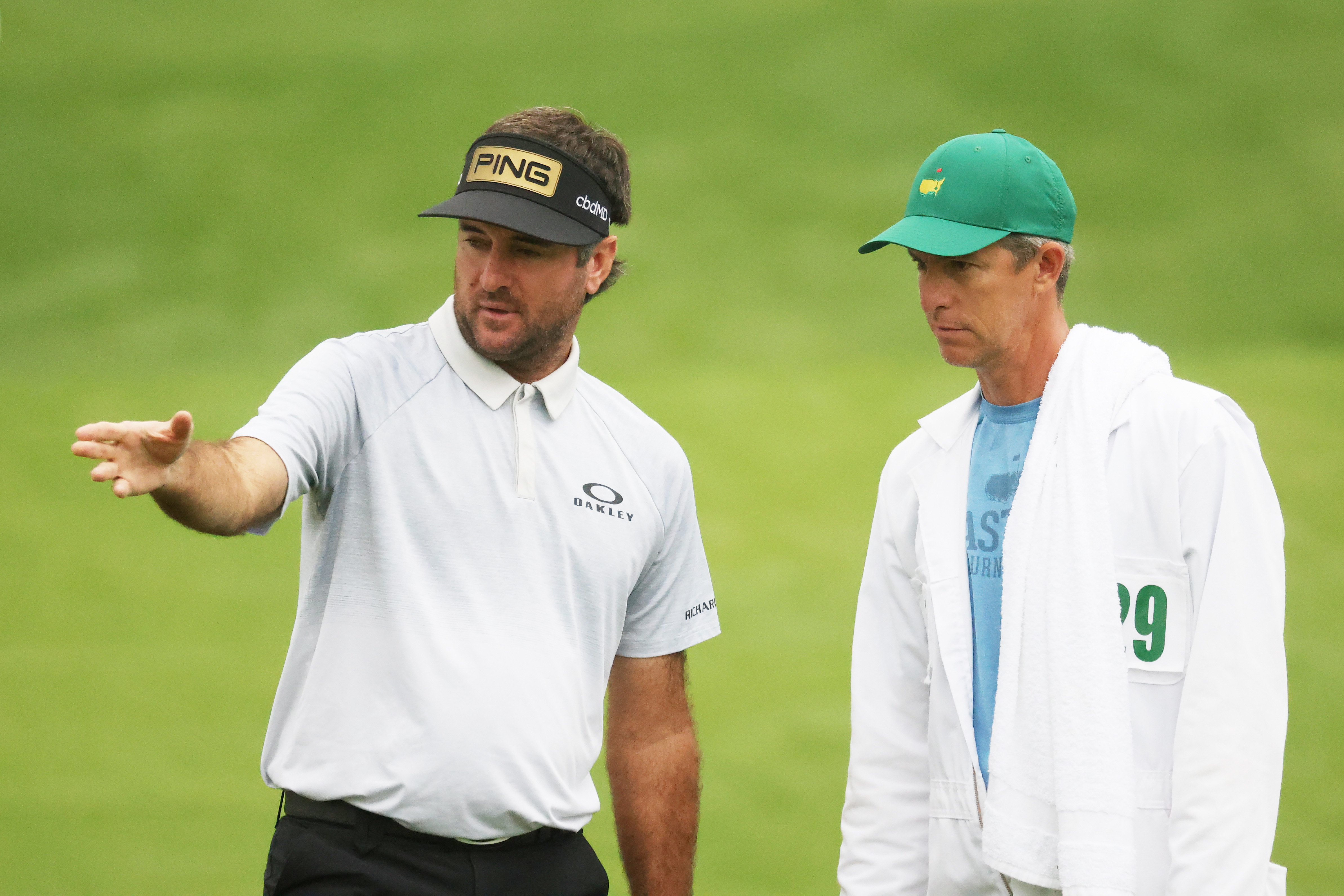 Bubba Watson (left) talks to Ted Scott during the 2021 Masters