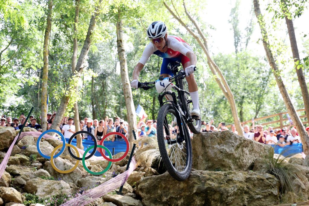 ELANCOURT FRANCE JULY 28 Pauline Ferrand Prevot of Team France competes in the breakaway during the Womens CrossCountry Cycling Mountain Bike Gold Medal race on day two of the Olympic Games Paris 2024 at Elancourt Hill on July 28 2024 in Elancourt France Photo by Jared C TiltonGetty Images