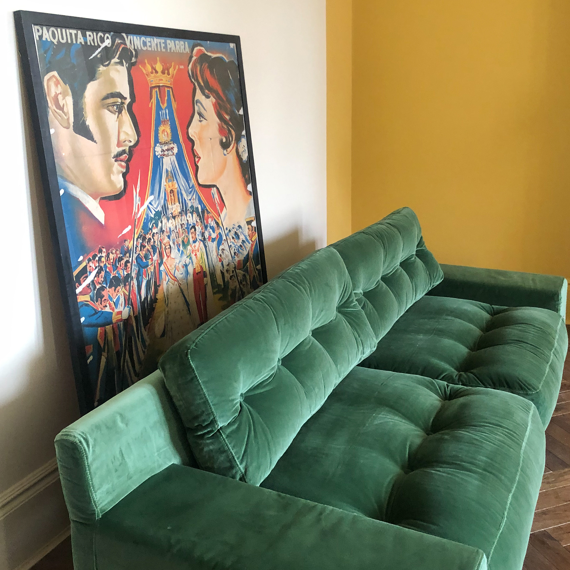 green sofa and film poster