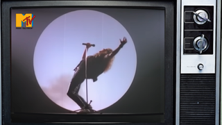 An 80s TV showing a clip from Whitesnake's Still of the Night video