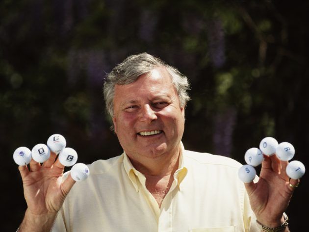 Peter Alliss with golf balls in his hands