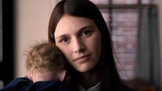 Nell Tiger Free as Leanne Grayson holding a baby in Servant