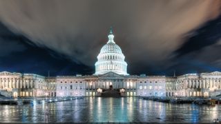 the us capitol building at night