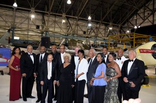 Actress Nichelle Nichols (black dress, center) and other attendees of the Shades of Blue gala, which was held Aug. 31, 2015, at the Wings Over the Rockies Air & Space Museum in Denver.
